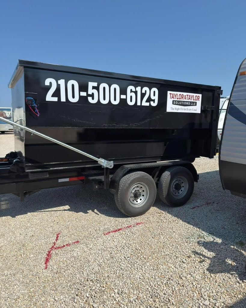 Side profile of a Taylor & Taylor roll-off dumpster showing phone and logo