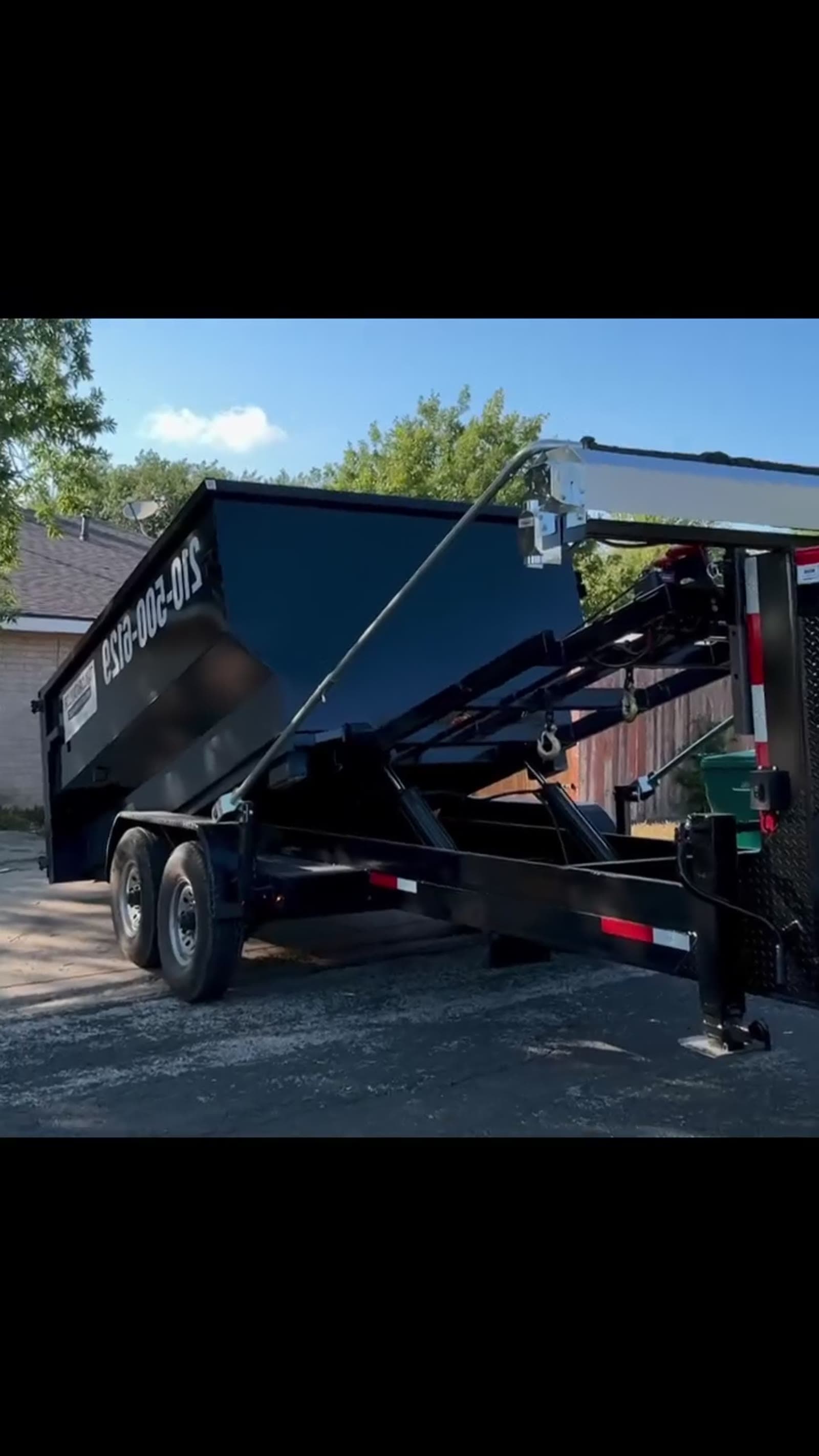 Taylor & Taylor dumpster staged on gravel from Instagram reel