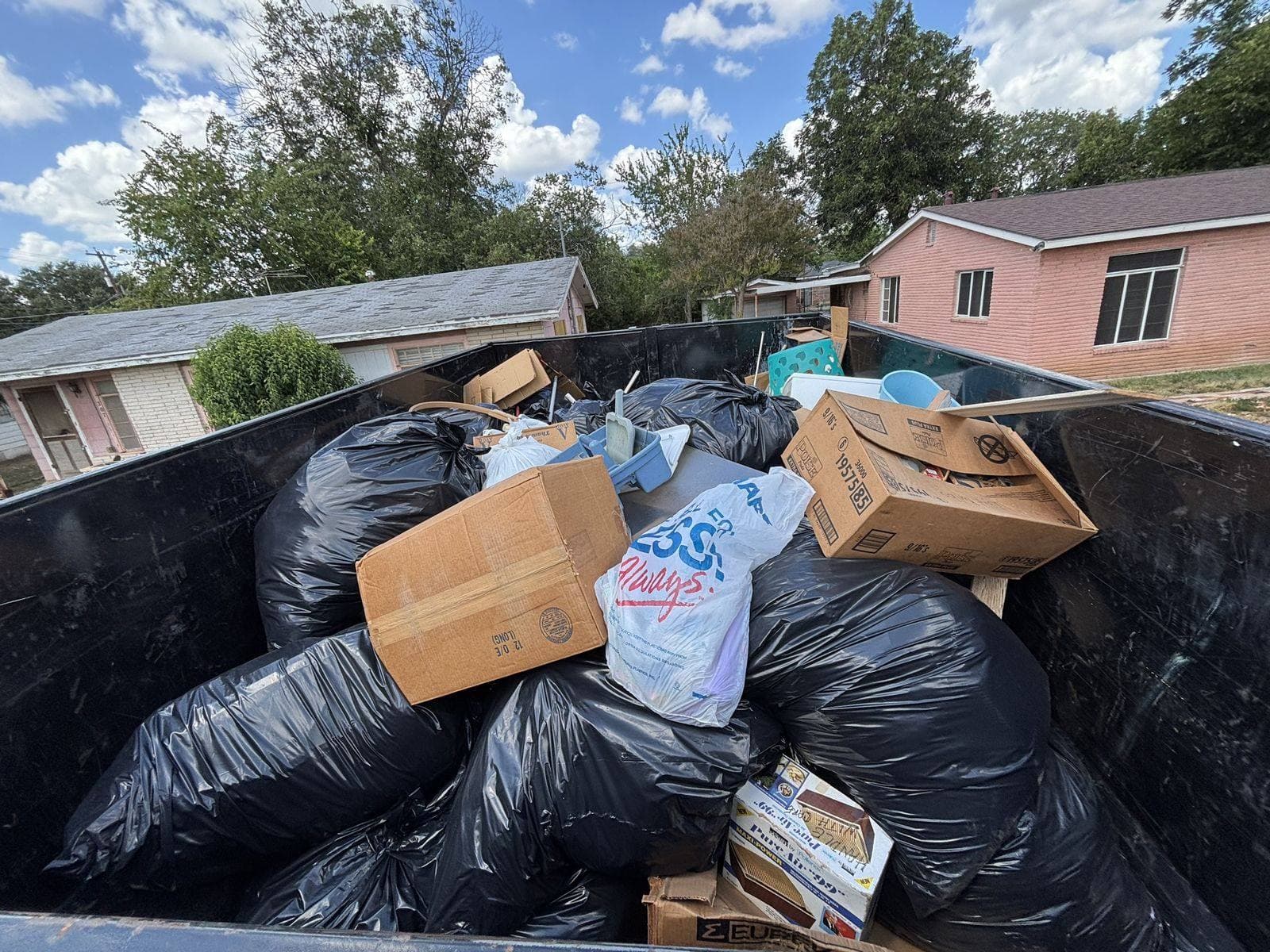 Taylor & Taylor dumpster at a household cleanout in San Antonio, TX